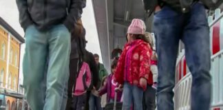 Crowd walking on a train platform
