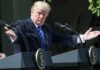 Right-Wing Backlash Erupts Over Trump Meeting Donald Trump speaking at dual podiums with arms outstretched