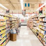 A grocery store aisle filled with various food products on shelves