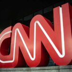 One Voting Claim Gets An On-Air Correction Large red CNN logo outside a modern building entrance