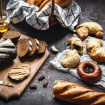 Bees Beat Time: Honey Doesn’t Spoil Assorted breads and pastries on a dark rustic surface