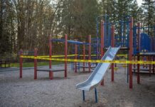 Chilling Notes, Four Coffins – Who Failed? Playground equipment wrapped with caution tape