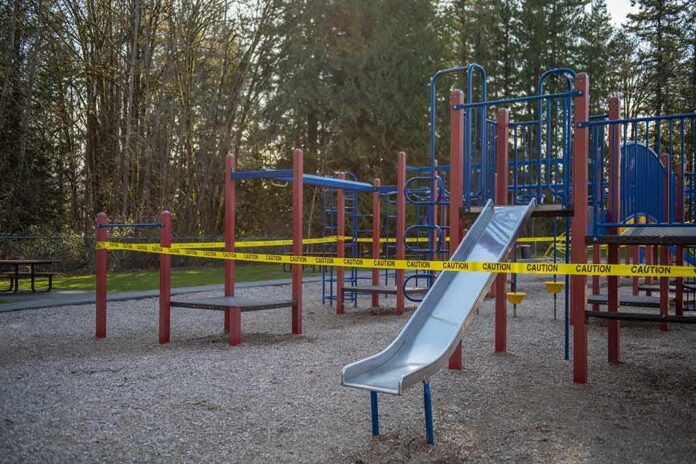 shutterstock_1699954372 Playground equipment wrapped with caution tape