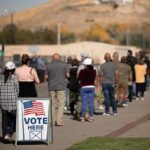 Squad Boosted Thanks to Unlikely PRIMARY WINNER! voters standing in a long line outside a polling place