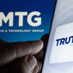 Trump’s Posts Now Come With a Premium Lane Smartphone showing Truth Social app icon beside TMTG logo on screen