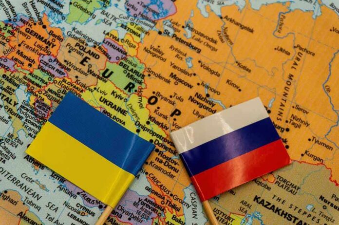 shutterstock_2109598166 Ukraine and Russia flags on a map of Eastern Europe