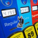 Wallet Hit: Gas Smashes Holiday Record Gas pump with prices and sticker on the Extra button