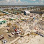 TSUNAMI Sirens RIP Across Southeast Asia Aerial view of coastal town with widespread storm damage