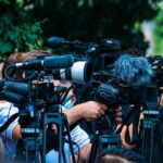Tradition Vs. Cruelty Clash Erupts TV news cameras crowding together at an outdoor event