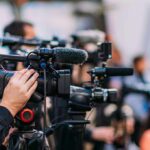 Sun-Powered Entanglement Stuns Labs Video cameras on tripods at a media event