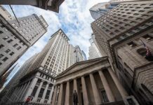 Wall Street’s New Money Machine Is Taking Over Skyscrapers and a neoclassical building with columns viewed from street level