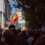 Spain Claimed World Cup Glory In Extra Time Crowd with Spanish flags in a city street