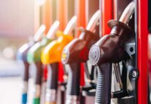 Close-up of fuel pump nozzles at a gas station