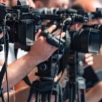 Teens Berated Courtside — Owner Suspended television cameras on tripods at a media event