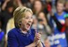 One Social Media Post Summoned An Awkward Past Smiling woman in blue clapping at an event