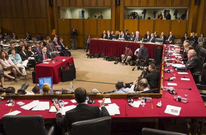 shutterstock_387761506-2 Patrick Leahy and Samuel Alito at a Senate hearing with committee and press present