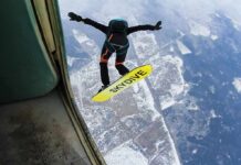 10,000-Foot Nightmare, Astonishing Comeback Skydiver jumps from plane with a skysurf board over snowy landscape