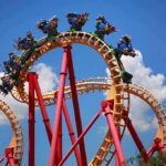Brain Injury Claims Explode at Six Flags Roller coaster train twists through a vertical loop