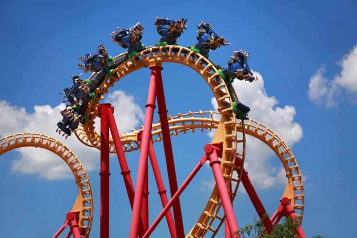 shutterstock_675711823 Roller coaster train twists through a vertical loop