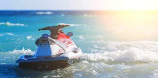 Jet ski on turquoise ocean waves near shore