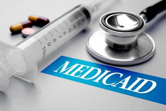 shutterstock_717417205 Stethoscope and syringe beside Medicaid label