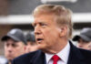 Donald Trump in profile with Brendan Steele and Jonathan Crompton blurred in the background