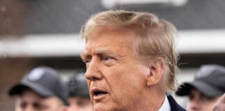 Donald Trump in profile with Brendan Steele and Jonathan Crompton blurred in the background