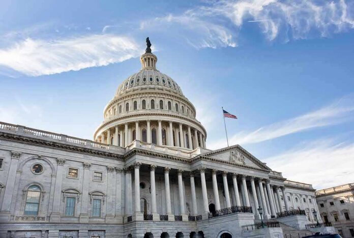shutterstock_1018169170-1 United States Capitol building under a blue sky