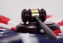 FBI Probes ICE Shooting – Case Stays Here Judge’s gavel on a base over an American flag