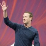 Tech Titans Draft, White House Endorses man in blue sweater waving on stage
