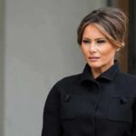 White House Credits Melania – War Pauses Melania Trump in a black coat looking to the side