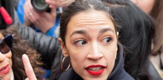 woman with red lipstick in a crowd turning her head