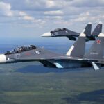 Crash Mystery: One Jet, Big Spin Two fighter jets flying in formation over landscape