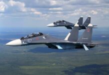 Crash Mystery: One Jet, Big Spin Two fighter jets flying in formation over landscape