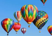 Colorful hot air balloons floating in a clear blue sky