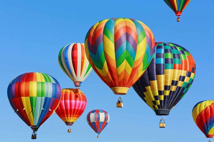 Colorful,Hot,Air,Balloons,Against,Blue,Sky Colorful hot air balloons floating in a clear blue sky