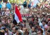 Houthi Ultimatum Rattles Oil Routes Crowd at a protest rally; Katherine Hull-Kirk, Farveez Maharoof, Bimal Lakra, Isha Lakhani, and Colin David Jones present