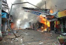 City Halls Torched – Macron Draws a Line Street marketplace engulfed in fire and heavy smoke