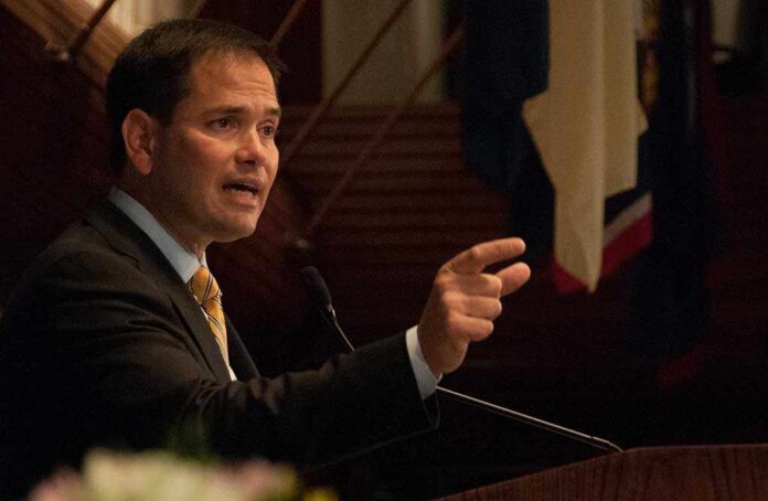 Marco Rubio speaking at a podium and gesturing with his hand