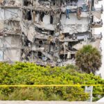 Partially collapsed apartment building with exposed interiors