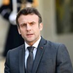 Protest Rights Trimmed – Courts Draw Lines man in a dark suit speaking outdoors