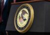 Department of Justice seal on a podium