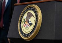 Sedition Convictions Vanish – Who Killed Them? Department of Justice seal on a podium