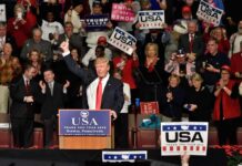 Red-State Alarm: Trump Rushes Clarksville Donald Trump addresses a rally crowd at a podium, raising his fist