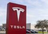 SpaceX Tech Launches Tesla – Not A Movie Tesla dealership sign in front of parking lot