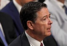 Deadline Gambit Triggers Comey Showdown James Comey speaking in profile at an event