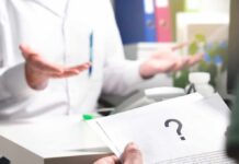A Campaign Absence Draws Fresh Questions About Timing Doctor gesturing during consultation with patient holding paper with question mark