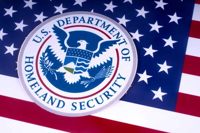 1051372526 featured image US Homeland Security emblem over American flag