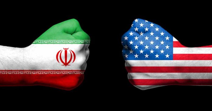 1086543533 featured image Two fists painted with Iran and USA flags.