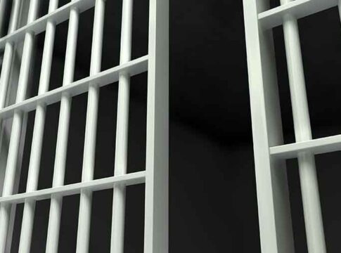 Close-up view of prison cell bars.